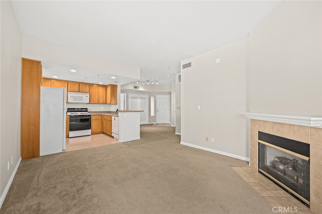 155 North Raymond Avenue Pasadena, CA 91103 - Photo 31 of 56 a view of a kitchen with a sink and a fireplace