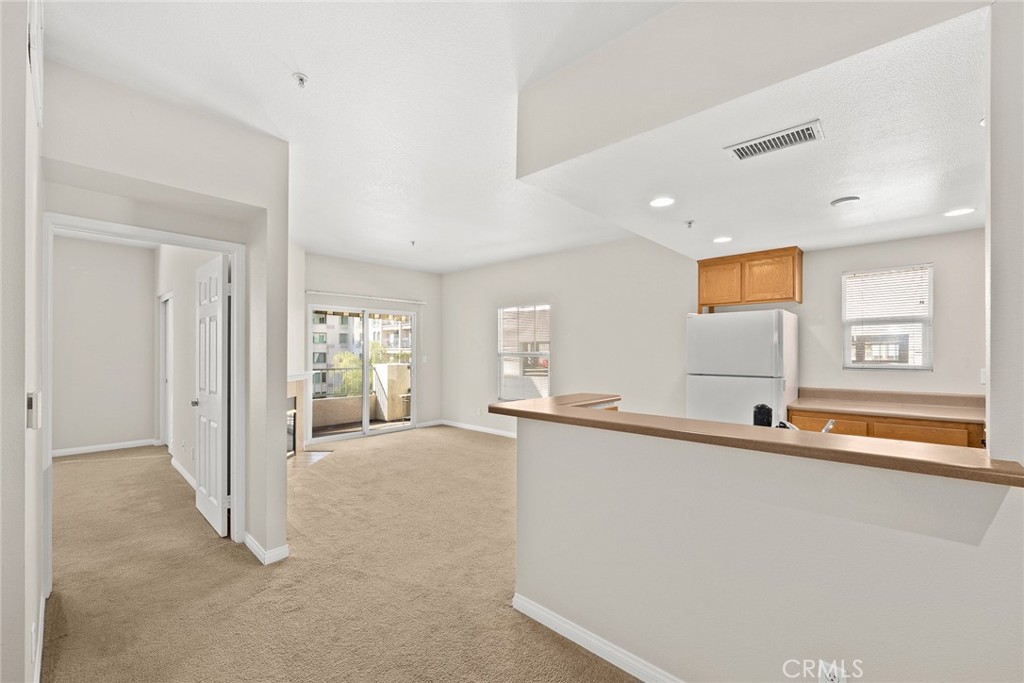 155 North Raymond Avenue Pasadena, CA 91103 - Photo 36 of 56 a view of a kitchen with stainless steel appliances a sink and a large window
