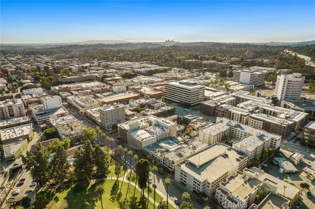 a view of a brick building with many windows