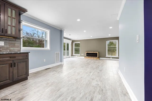 a view of a wooden deck with a yard