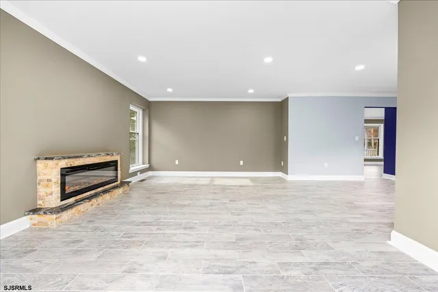a view of a house with a yard and sitting area