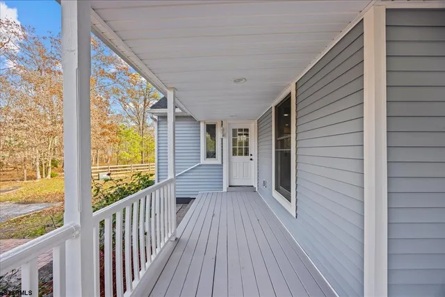 a kitchen with a refrigerator and a sink