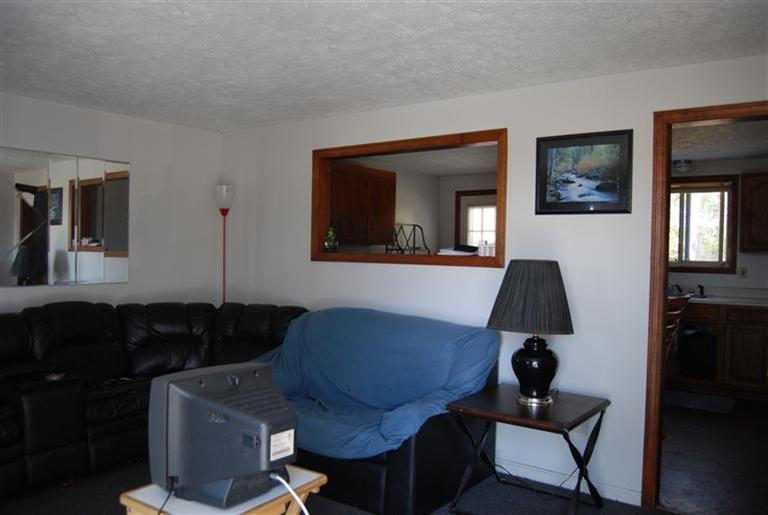 10 Red Brook Road, Unit A & B East Wareham, MA 02538 - Photo 3 of 15 a living room with furniture and a window