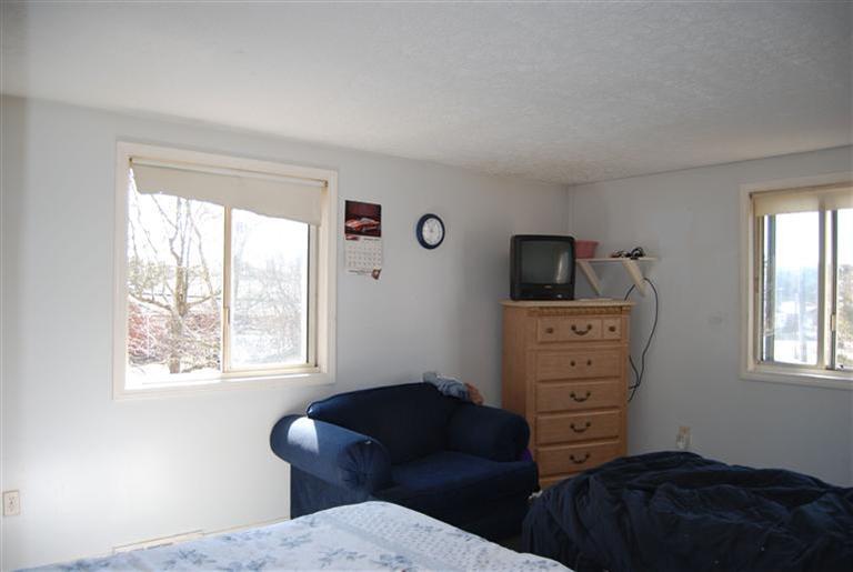 10 Red Brook Road, Unit A & B East Wareham, MA 02538 - Photo 7 of 15 a bedroom with a bed and a television