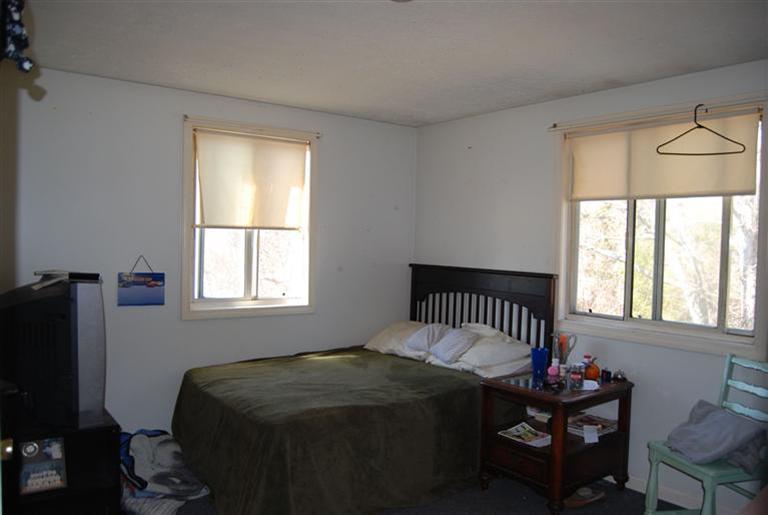 10 Red Brook Road, Unit A & B East Wareham, MA 02538 - Photo 8 of 15 a bedroom with a bed and a window