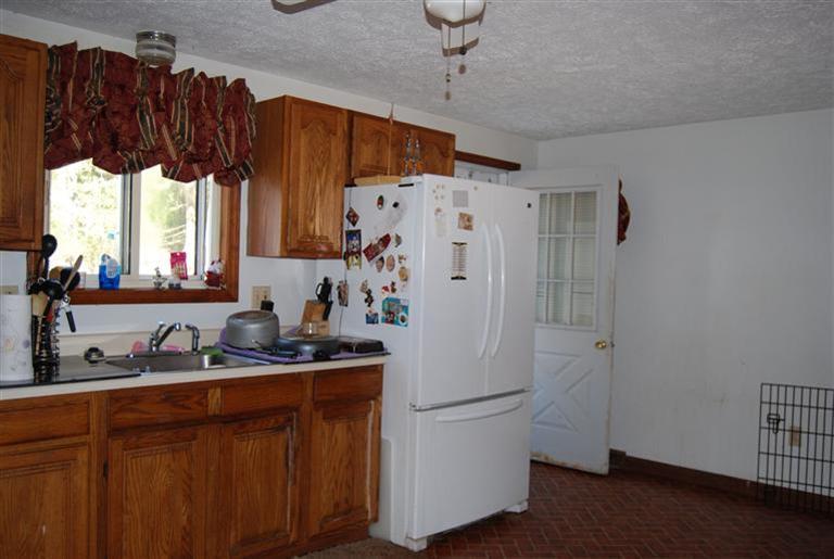 10 Red Brook Road, Unit A & B East Wareham, MA 02538 - Photo 9 of 15 a white refrigerator freezer sitting inside of a kitchen