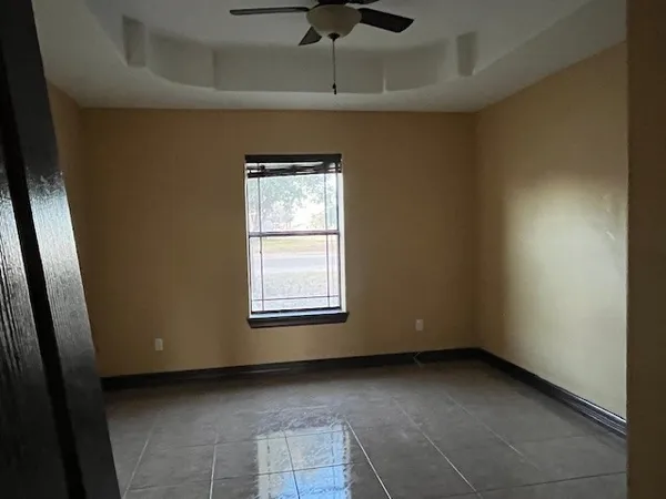 a view of an empty room with a window
