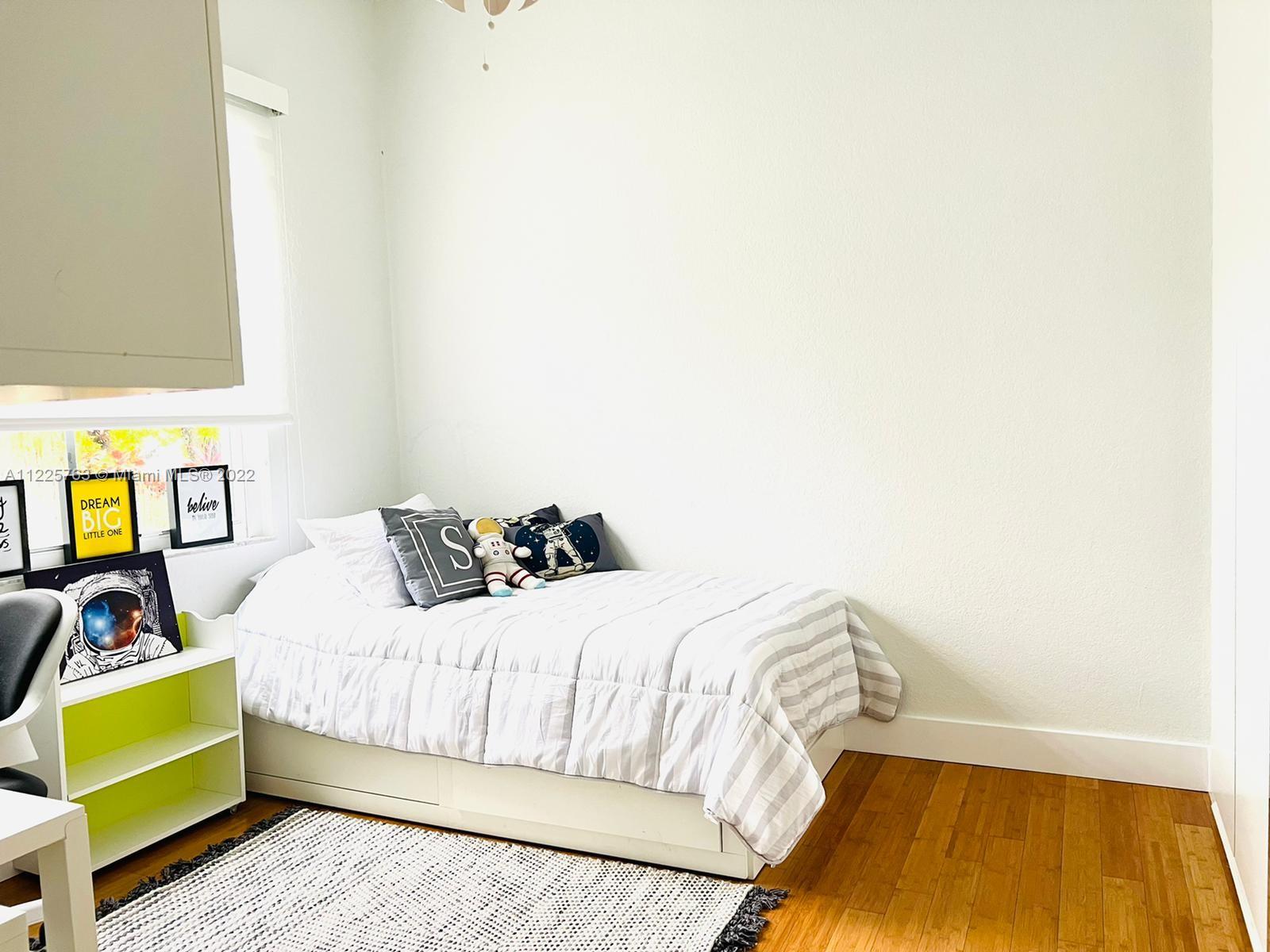 862 Tulip Circle Weston, FL 33327 - Photo 18 of 29 a bedroom with a bed and a window