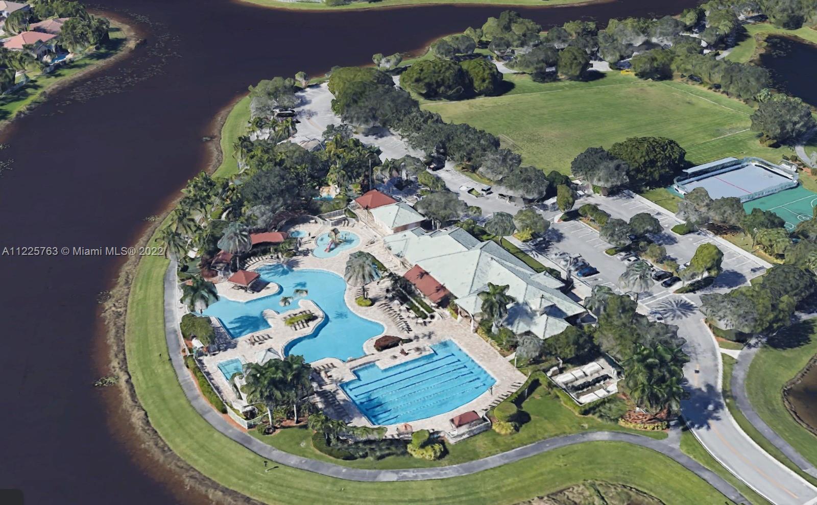 862 Tulip Circle Weston, FL 33327 - Photo 29 of 29 a view of a swimming pool with a yard