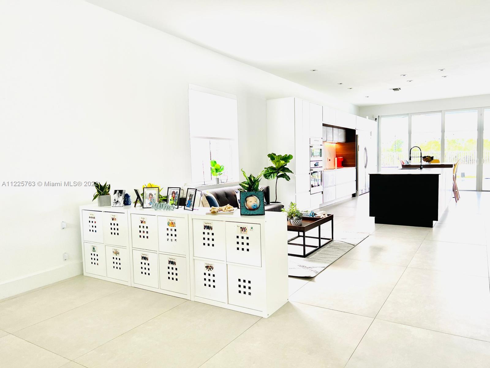 862 Tulip Circle Weston, FL 33327 - Photo 3 of 29 a living room with furniture and a flat screen tv