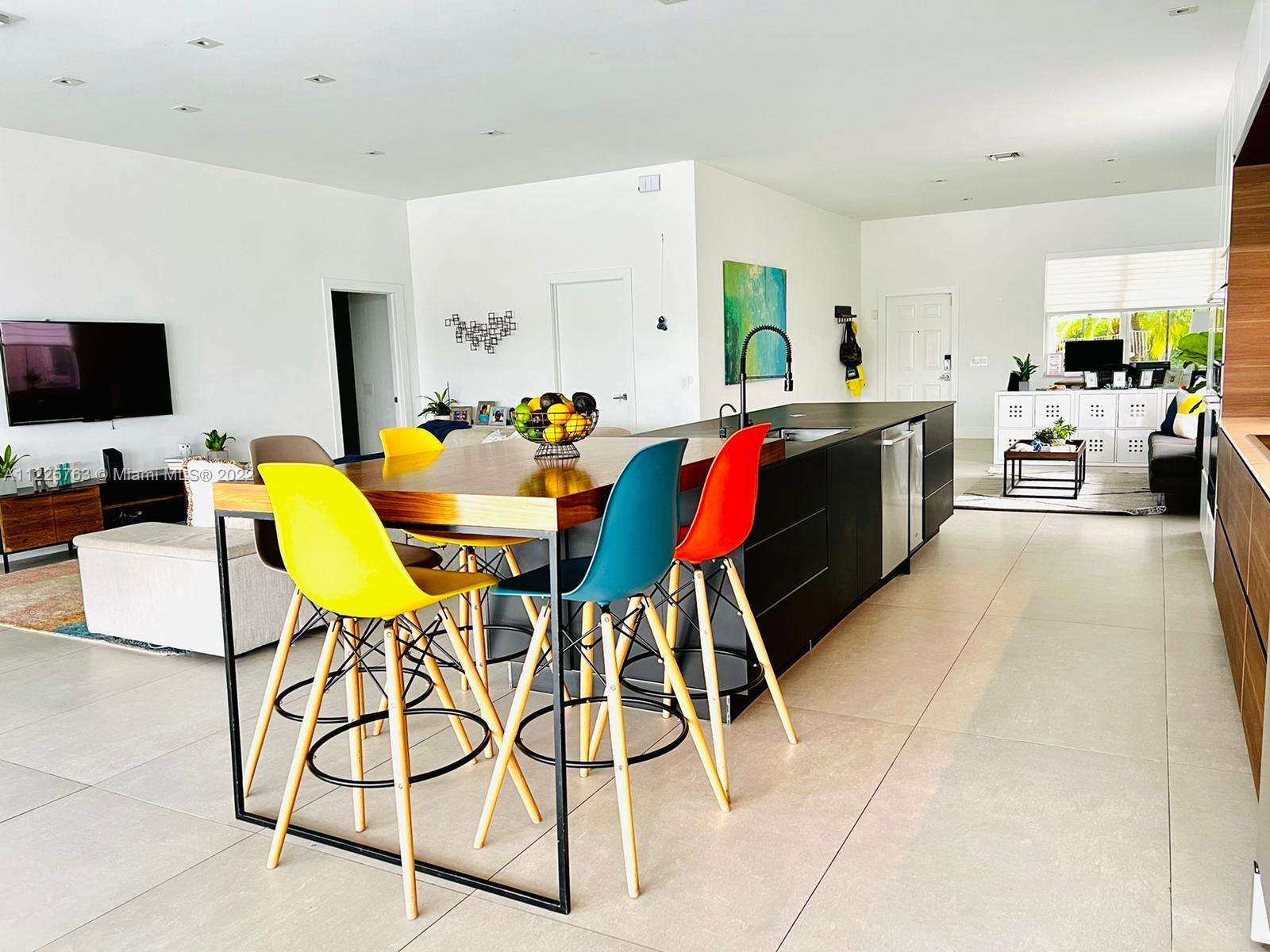 862 Tulip Circle Weston, FL 33327 - Photo 9 of 29 a living room with furniture and a flat screen tv