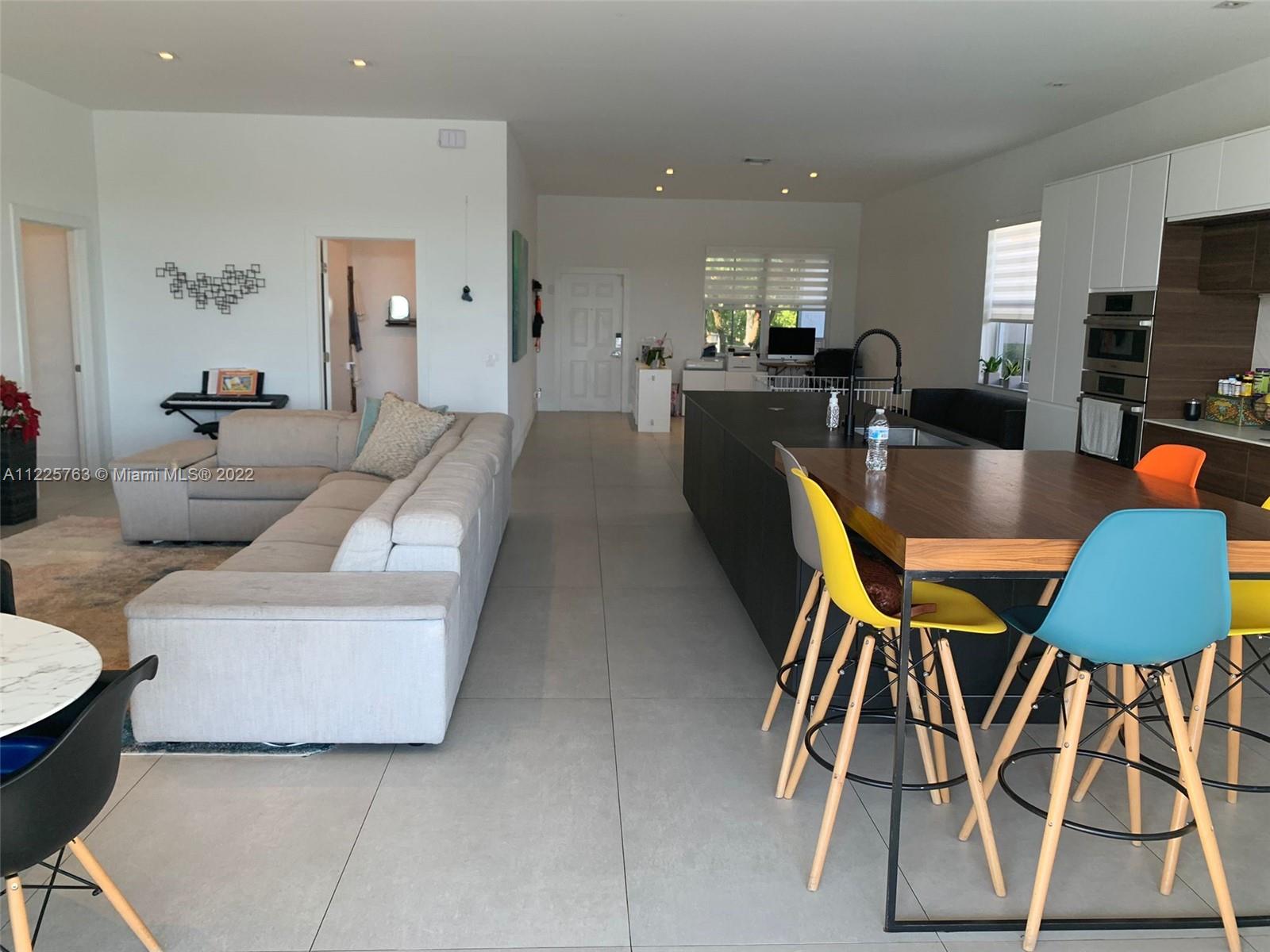 862 Tulip Circle Weston, FL 33327 - Photo 10 of 29 a living room with furniture and kitchen view