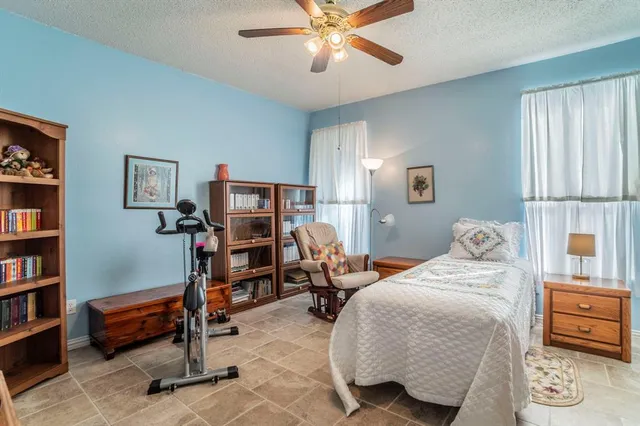 a bedroom with furniture and a bed