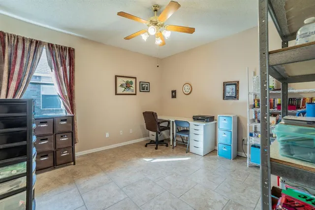 a view of a livingroom with furniture and a window