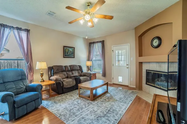 a living room with furniture and a fireplace