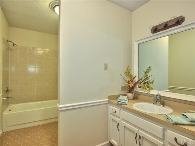 2701 Smokey Ridge Road Raleigh, NC 27613 - Photo 20 of 25 Full bathroom in the basement. Vanity area is separate from the toilet and tub area. Bathroom