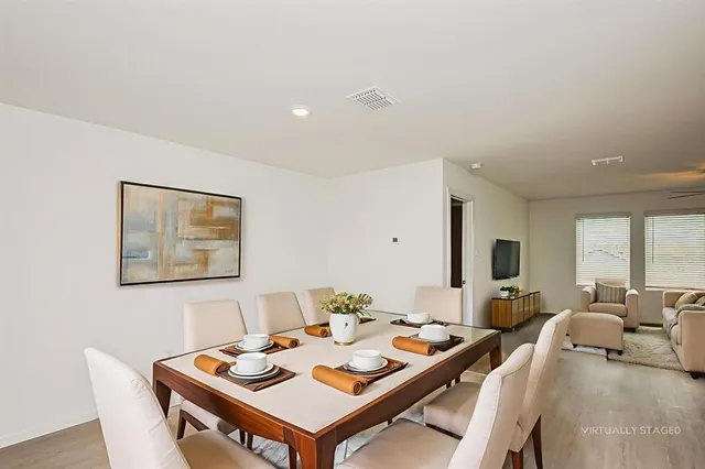 a view of a kitchen with a sink cabinets and stainless steel appliances