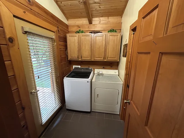 a view of a dining room with furniture and window