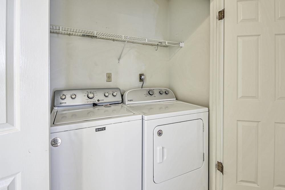 7448 Gingerhill Lane Bartlett, TN 38133 - Photo 16 of 39 a utility room with dryer and washer