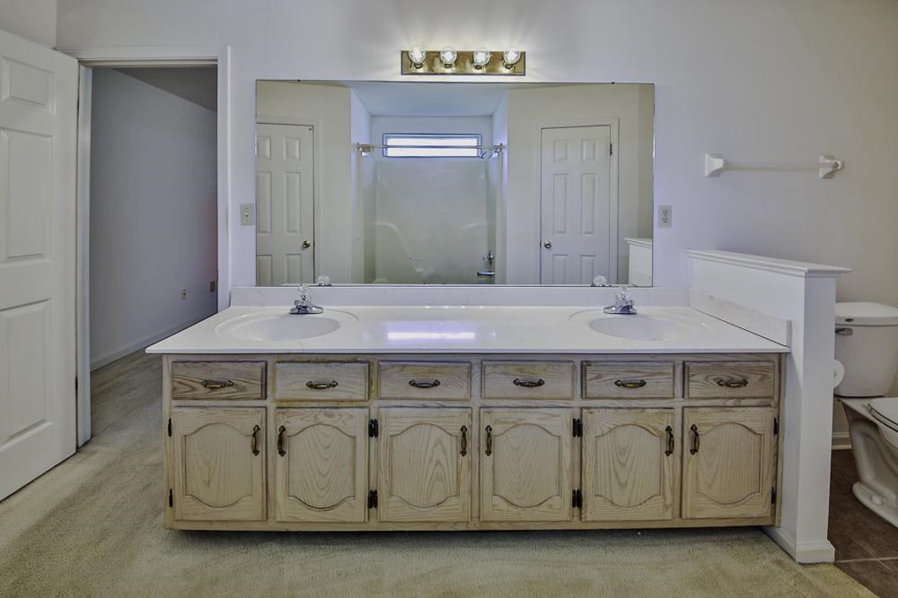 7448 Gingerhill Lane Bartlett, TN 38133 - Photo 19 of 39 a bathroom with a sink and a mirror