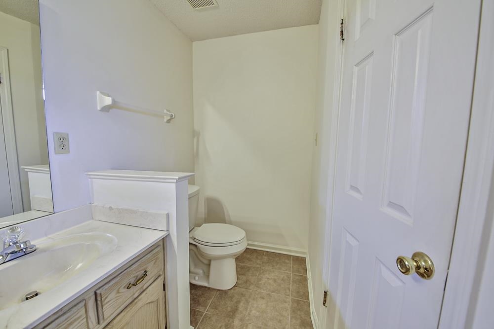 7448 Gingerhill Lane Bartlett, TN 38133 - Photo 20 of 39 a bathroom with a sink toilet and vanity