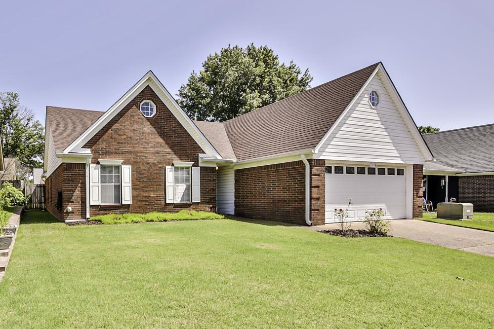 7448 Gingerhill Lane Bartlett, TN 38133 - Photo 2 of 39 a view of a house with a yard and potted plants