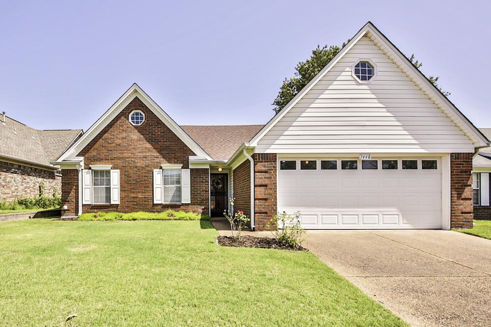 7448 Gingerhill Lane Bartlett, TN 38133 - Photo 3 of 39 a front view of house with yard and trees in the background