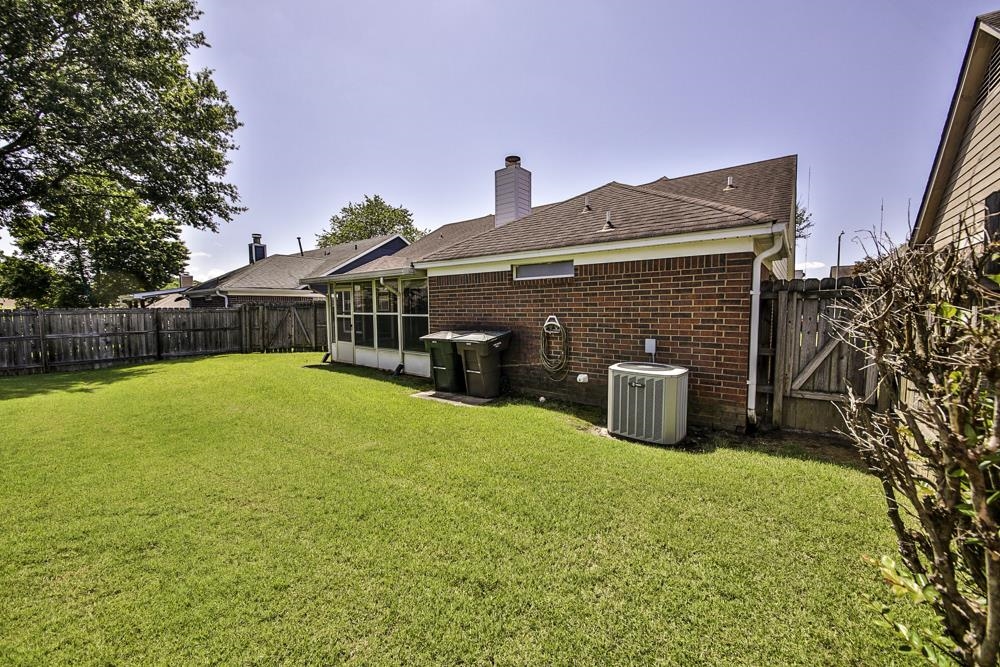 7448 Gingerhill Lane Bartlett, TN 38133 - Photo 32 of 39 a front view of a house with a yard