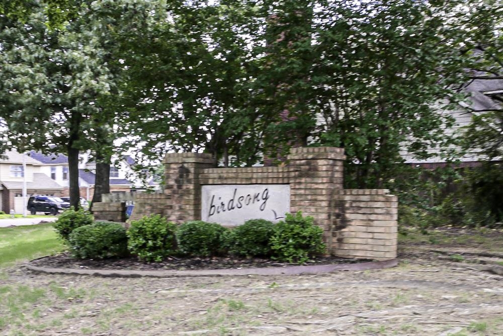 7448 Gingerhill Lane Bartlett, TN 38133 - Photo 36 of 39 a front view of a house with a yard and a fountain