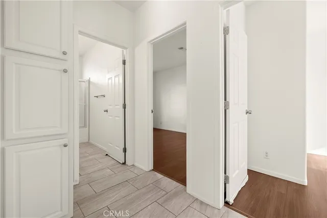 an empty room with wooden floor