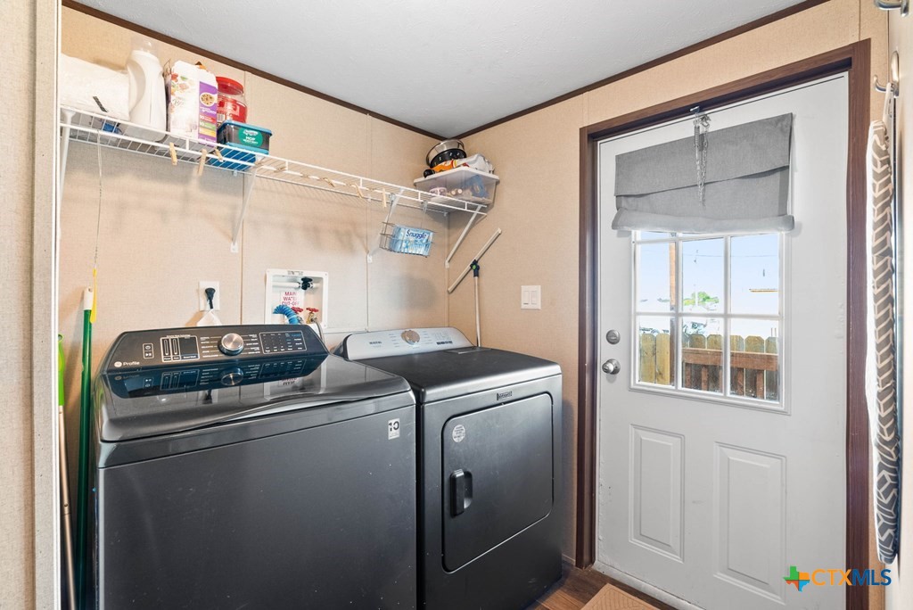 239 Allen M Parks Drive Rockport, TX 78382 - Photo 16 of 29 a utility room with dryer and washer