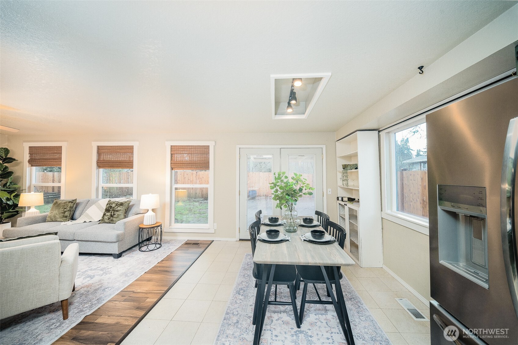 809 Cardigan Street Northwest Olympia, WA 98502 - Photo 11 of 30 a living room with furniture wooden floor and a large window