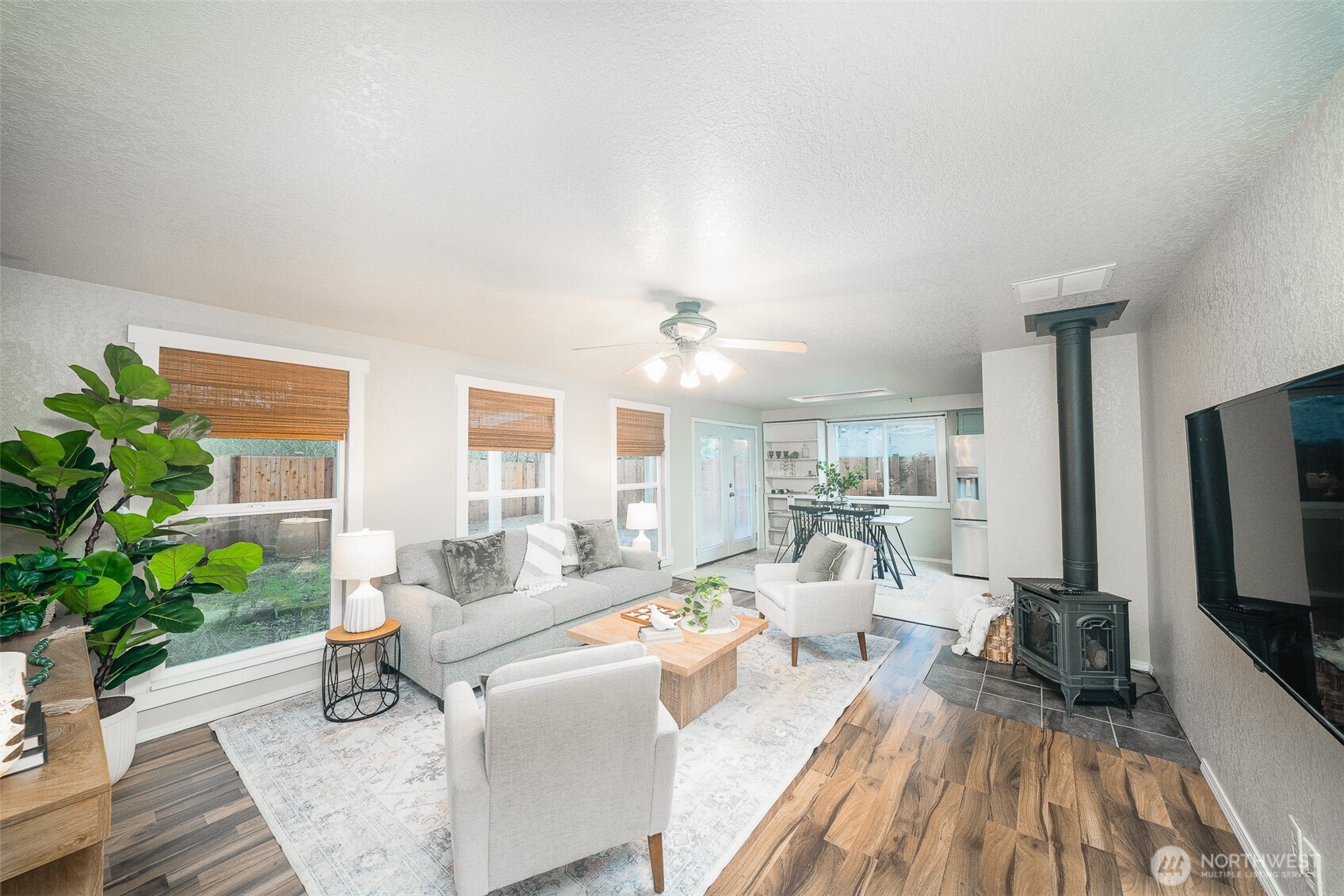 809 Cardigan Street Northwest Olympia, WA 98502 - Photo 14 of 30 a living room with furniture and a flat screen tv