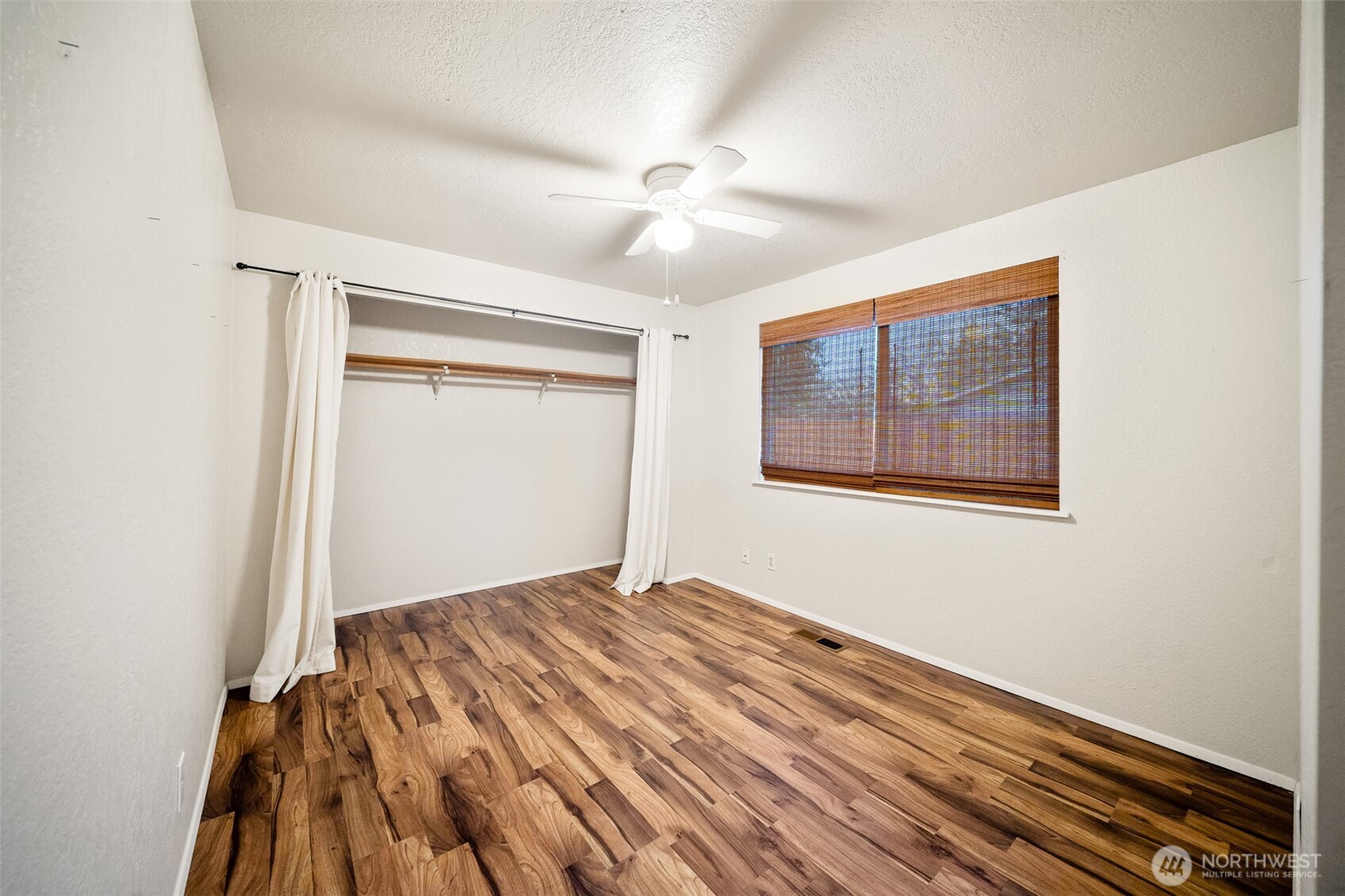809 Cardigan Street Northwest Olympia, WA 98502 - Photo 16 of 30 a view of empty room with wooden floor