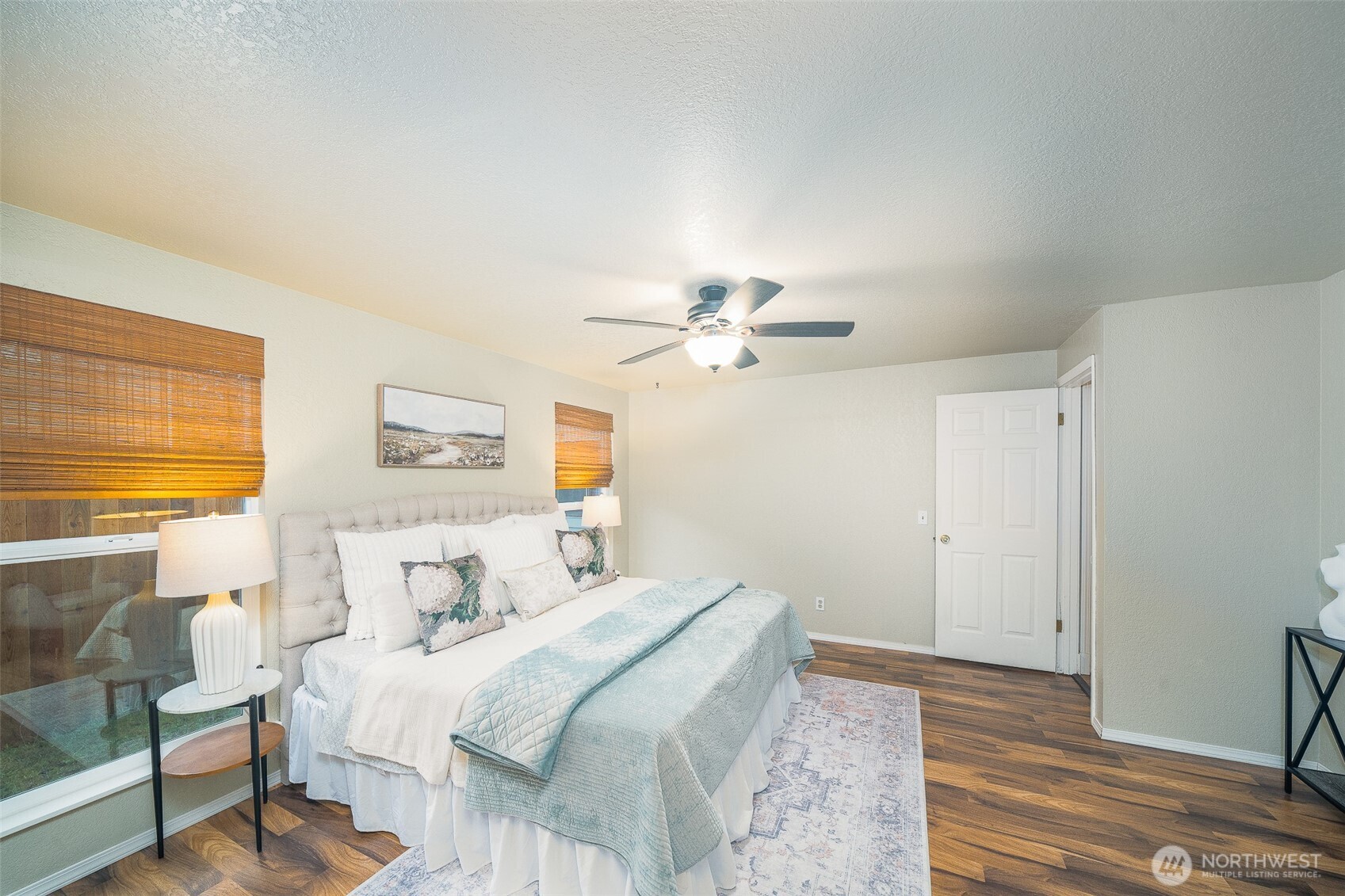 809 Cardigan Street Northwest Olympia, WA 98502 - Photo 21 of 30 a bedroom with a bed and a chandelier