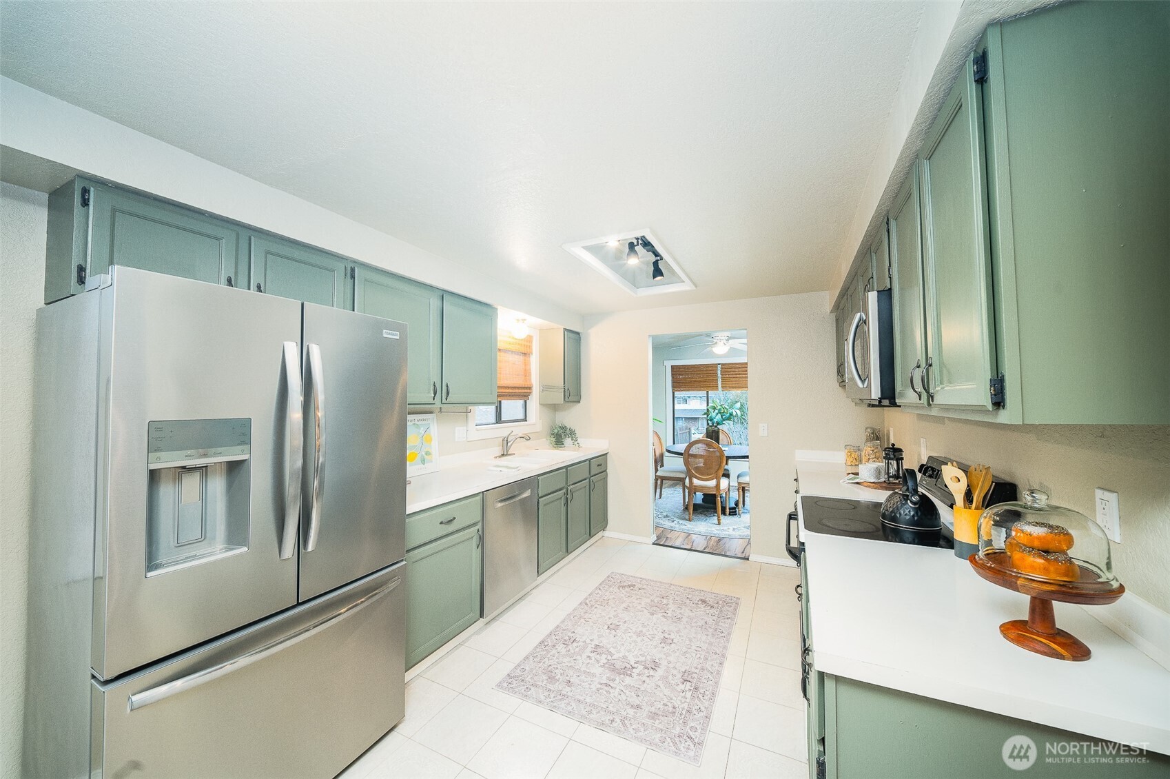 809 Cardigan Street Northwest Olympia, WA 98502 - Photo 8 of 30 a kitchen with a refrigerator and a sink