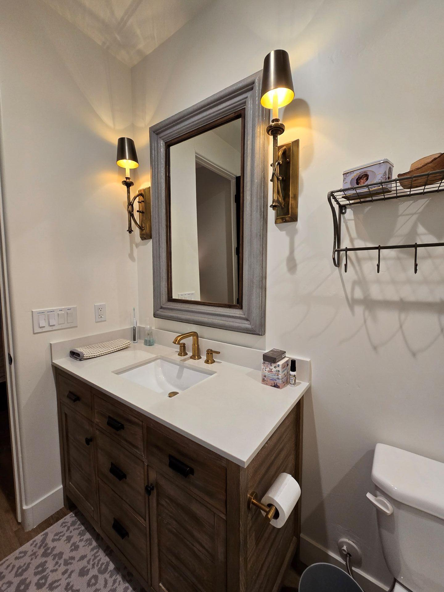 240 Rockinghorse Bend Road Payson, AZ 85541 - Photo 31 of 53 a bathroom with a sink a toilet and mirror