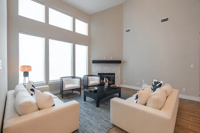 a living room with furniture and a large window