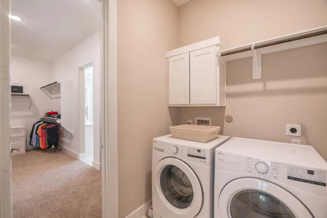 a view of storage and utility room with washer and dryer
