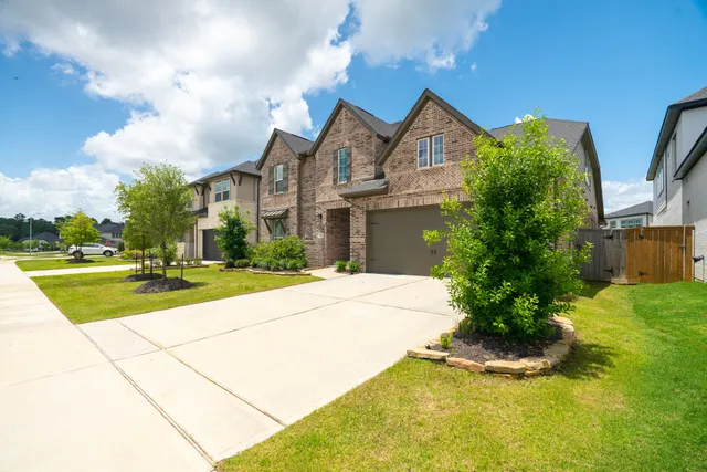 a view of house with yard and entertaining space