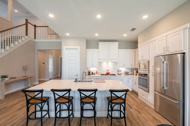 a kitchen with a table and chairs in it