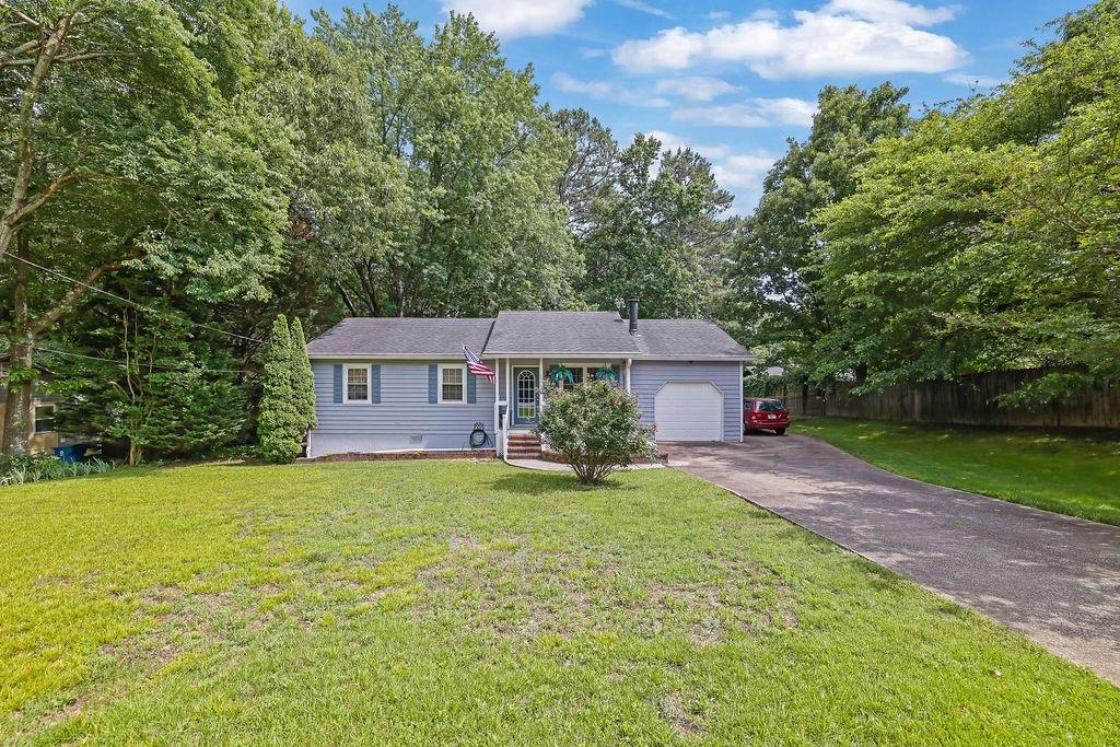 1555 Rock Springs Road Buford, GA 30519 - Photo 2 of 27 a view of a house with a yard