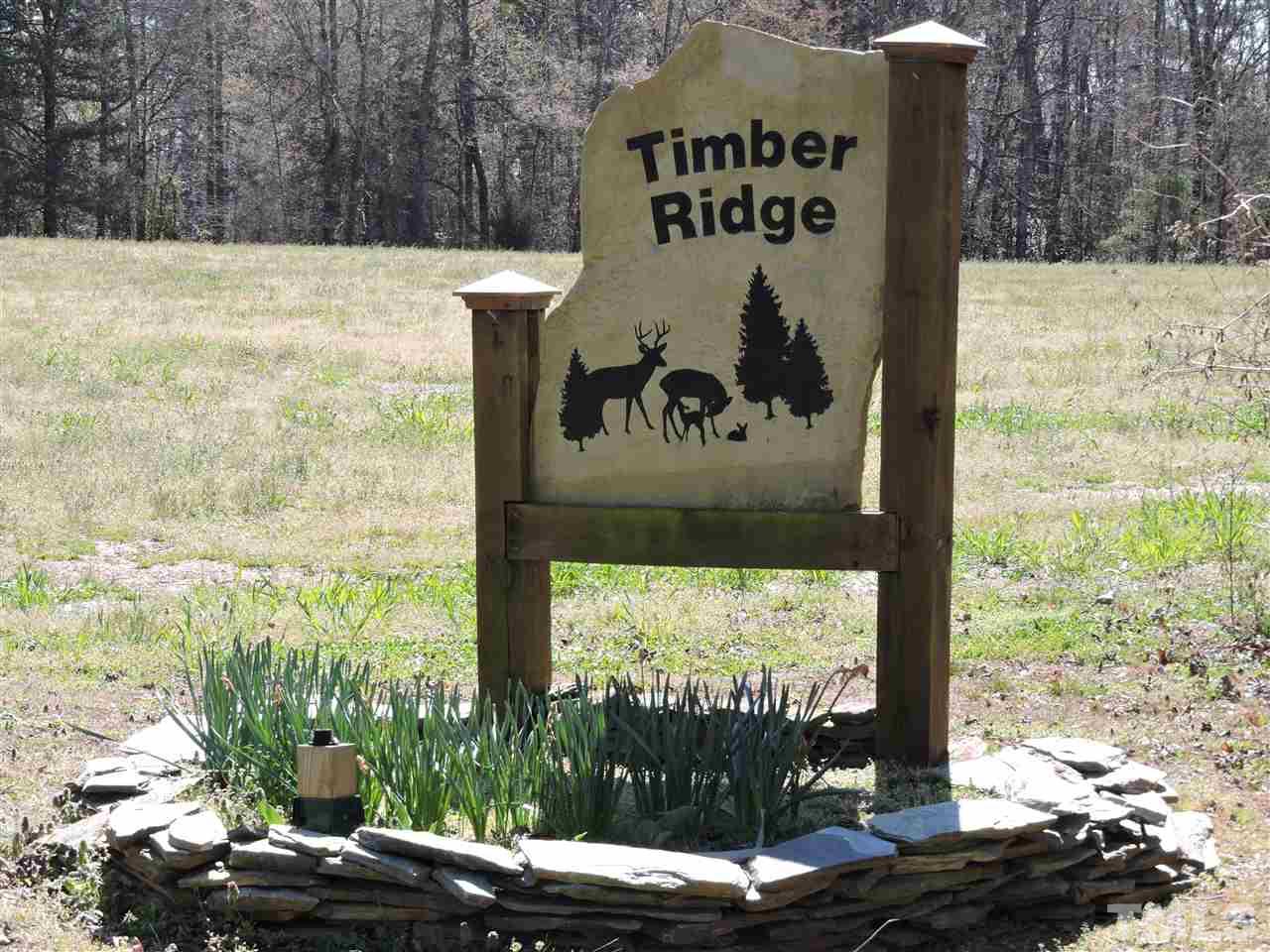 2.23 Amber Road Timberlake, NC 27583 - Photo 2 of 5 a sign that is on the side of a building