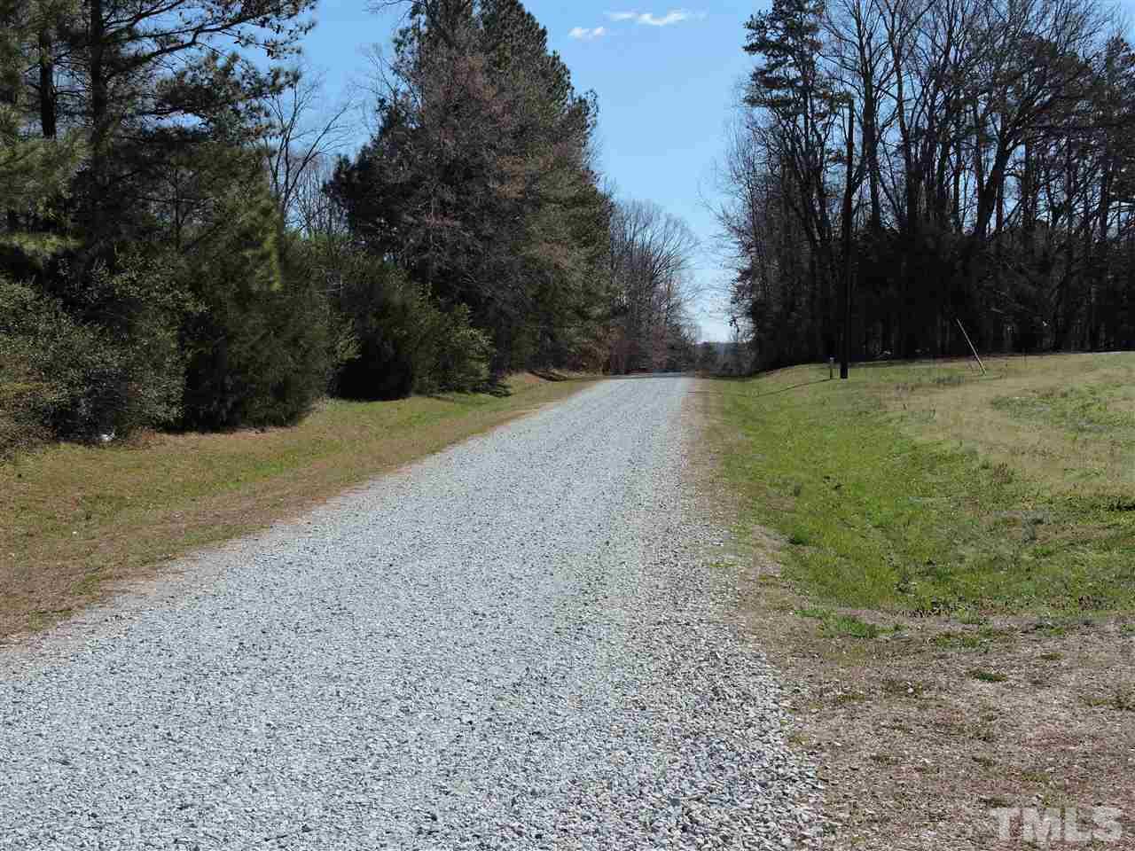 2.23 Amber Road Timberlake, NC 27583 - Photo 3 of 5 a view of a yard with trees