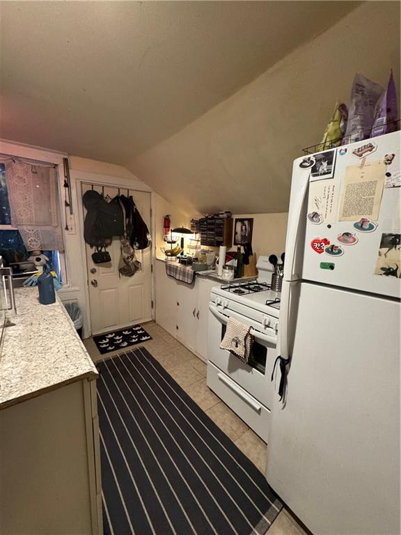 238-242 Philadelphia Street Indiana, PA 15701 - Photo 19 of 25 a kitchen with a stove and a sink