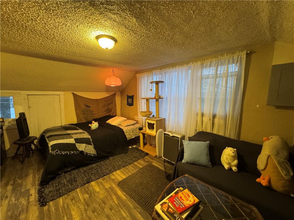 238-242 Philadelphia Street Indiana, PA 15701 - Photo 22 of 25 a bedroom with a bed and wooden floor