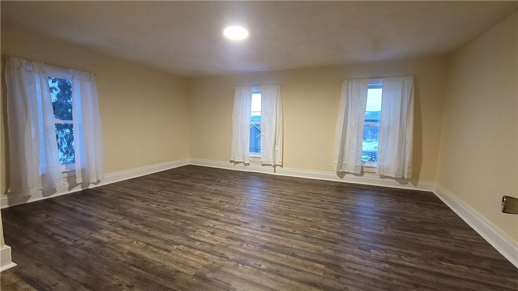 238-242 Philadelphia Street Indiana, PA 15701 - Photo 10 of 25 an empty room with wooden floor and windows