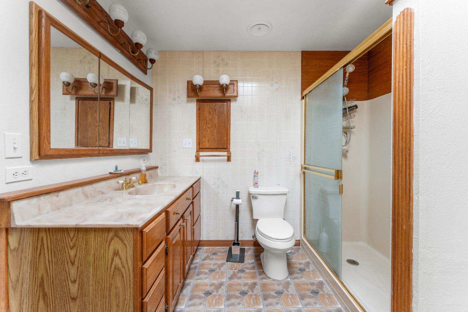 6849 26th Street Rio Linda, CA 95673 - Photo 18 of 56 a bathroom with a sink toilet and shower