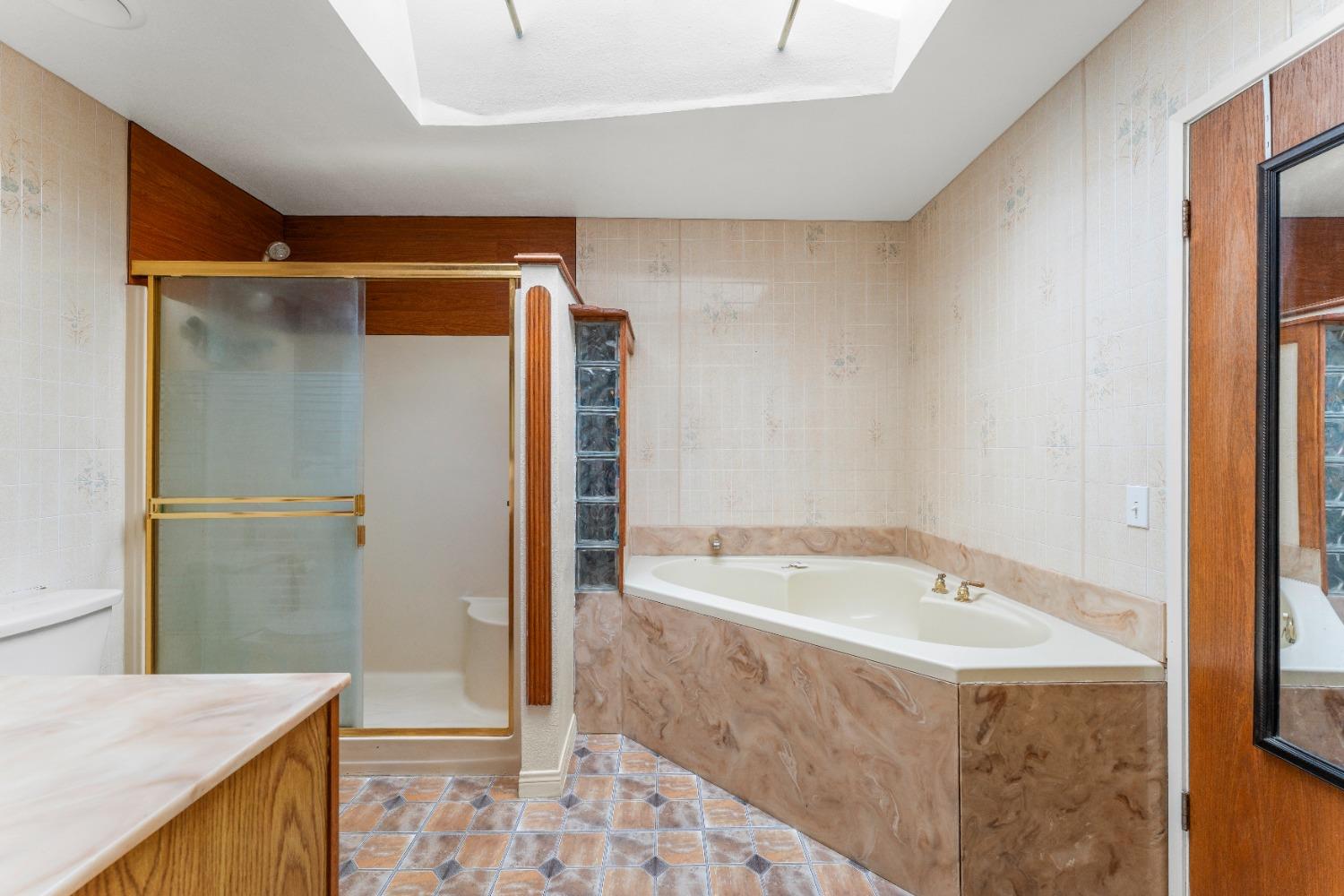 6849 26th Street Rio Linda, CA 95673 - Photo 19 of 56 a bathroom with a bathtub and a shower