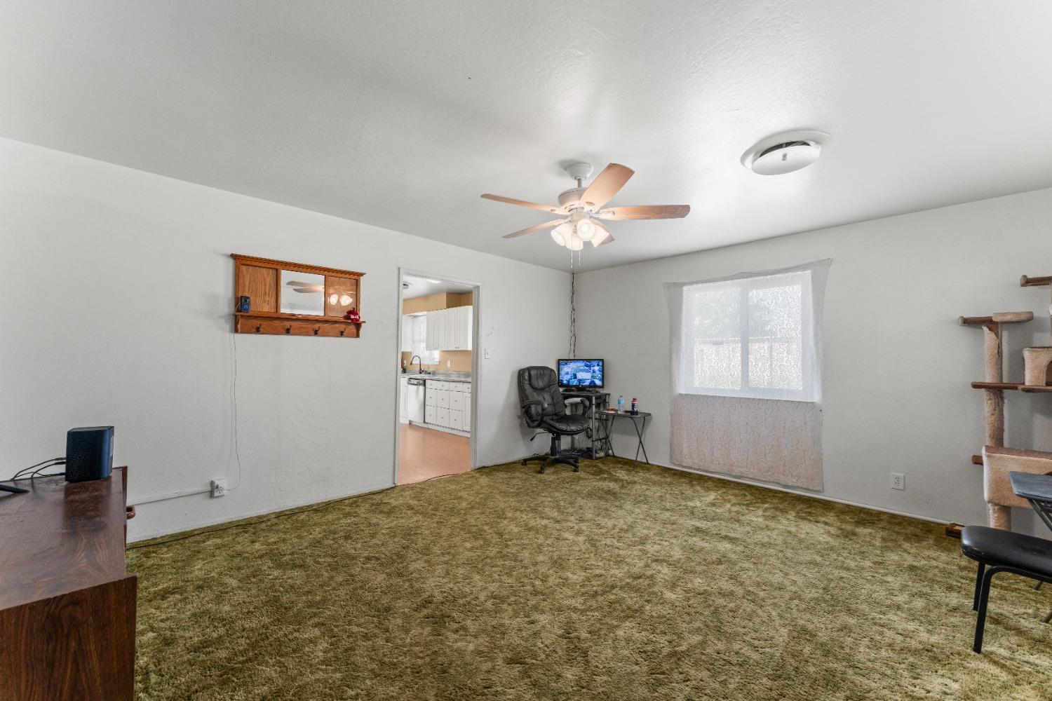 6849 26th Street Rio Linda, CA 95673 - Photo 26 of 56 a view of a workspace with furniture and a window